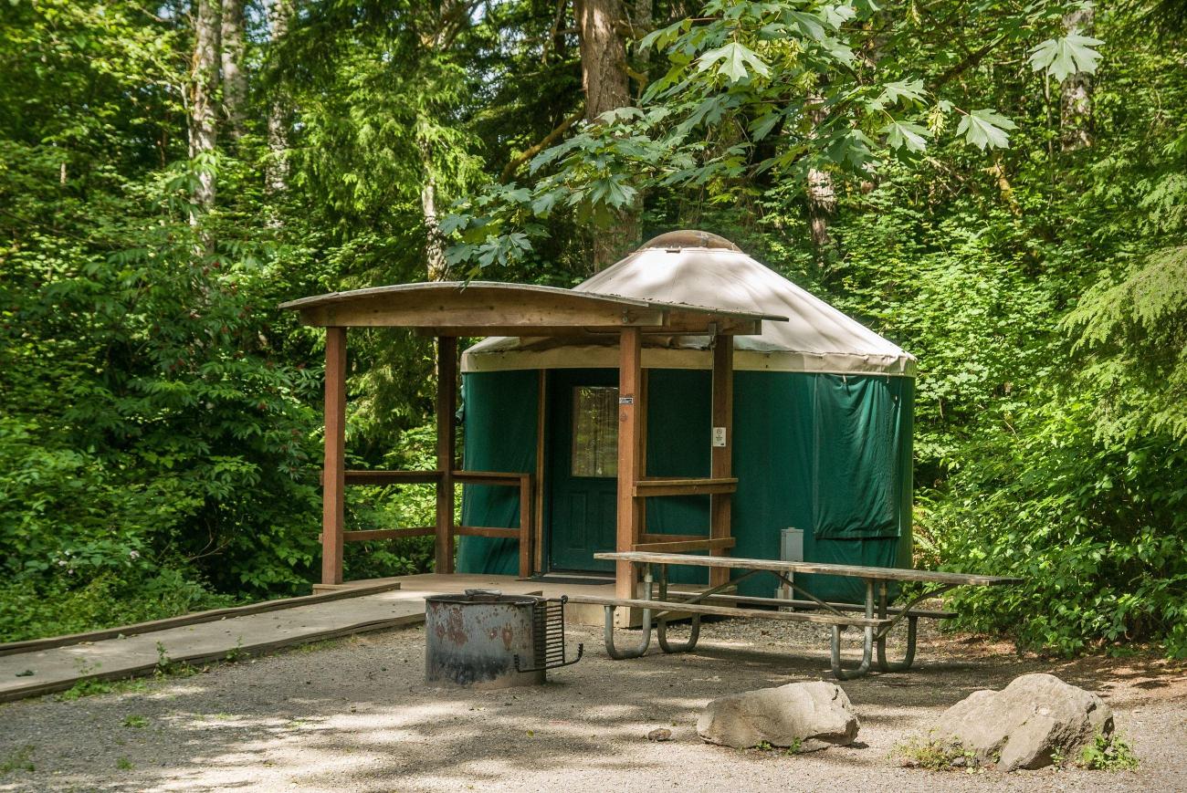 A yurt sits in the forest at Kanaskat-Palmer State Park