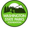 Circular green graphic of the Washington State Parks Foundation. It features the foundation's name and outlines of people hiking through iconographic images of trees and mountains.