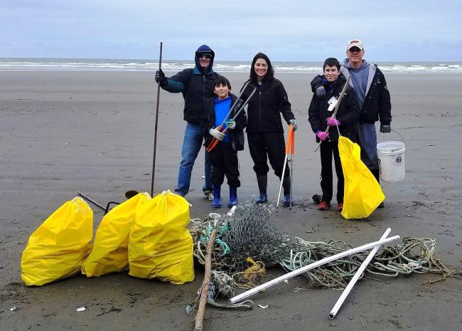 Family helping at the beach cleanup
