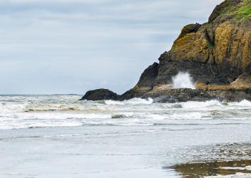 Waves crashing against the rock at Cape Disappointment