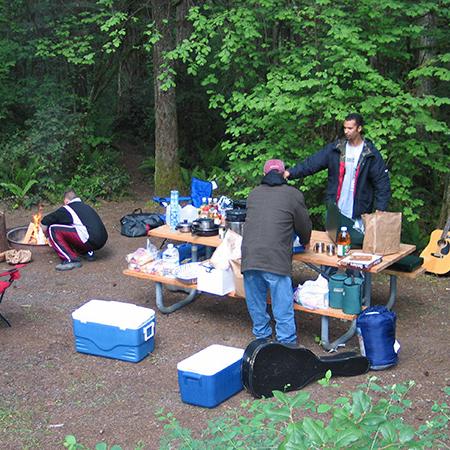 Campers picnic at a campsite at Seaquest State Park