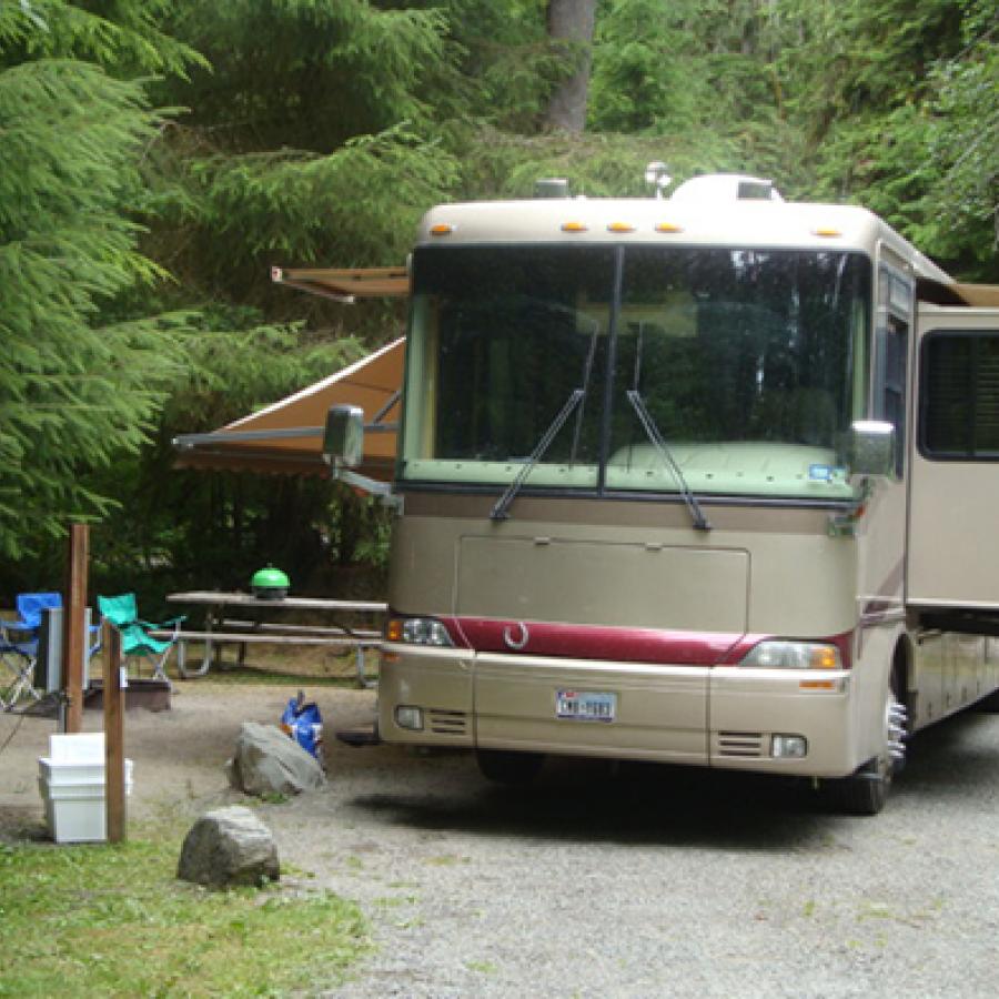 An RV in the campground of Bogachiel State Park.