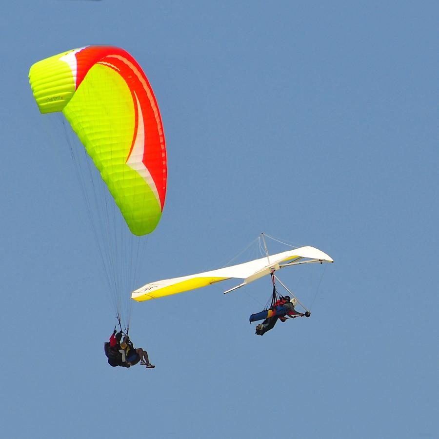 Paragliders and Hang-Gliders in the sky.